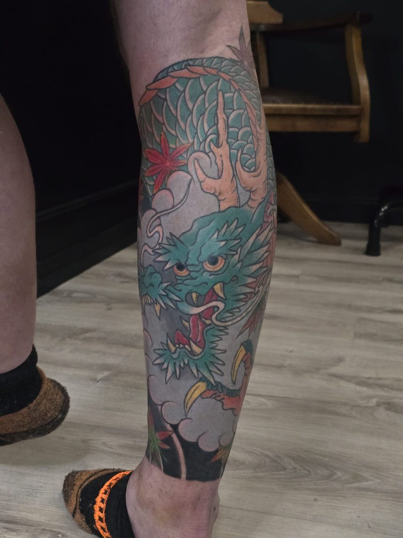 Japanese style colour dragon with maple leaves by Bruno at Hobart Tattoos