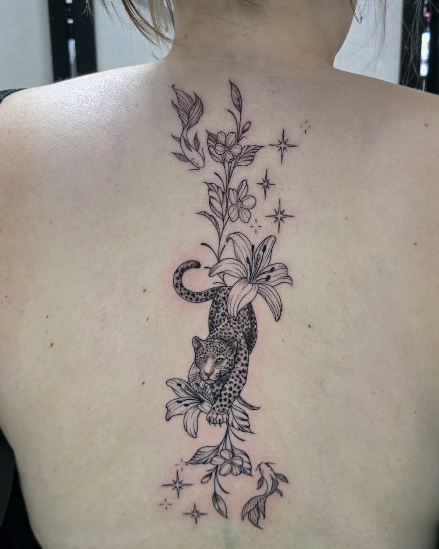 Fine line leopard, lilies, koi and stars down the spine by Bruno at Hobart Tattoos